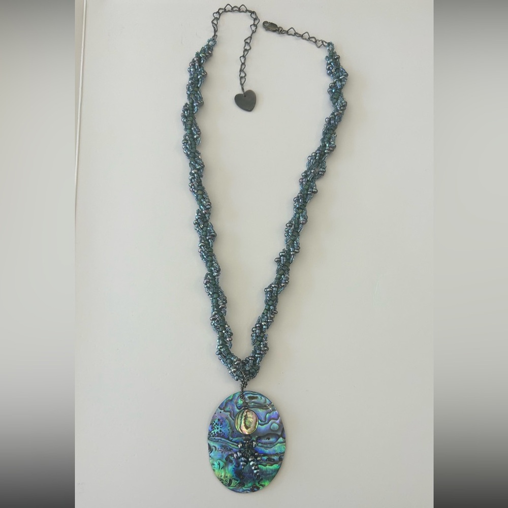 Abalone shell with beads necklace. Heart clasp